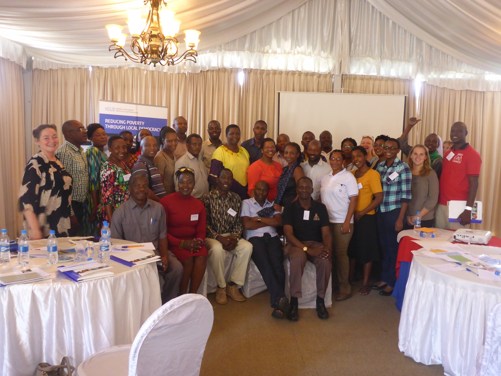 Men and women gathered at a workshop.